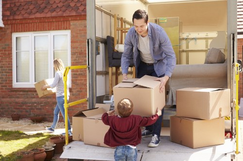 Loading boxes and household items into a moving van