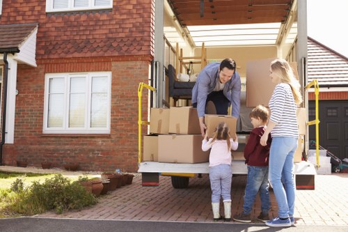 Business relocation process with boxes and office equipment