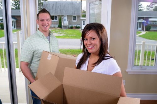 Local movers helping a Shirley household move furniture