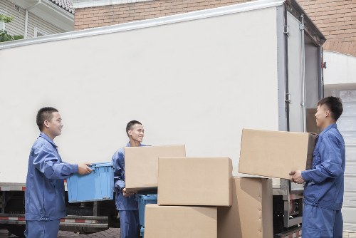 Unpacking service arranging boxes in a Shirley property after a move