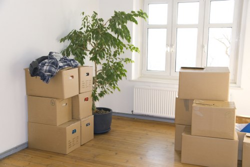 Local removals team handling furniture in a Shirley residential street