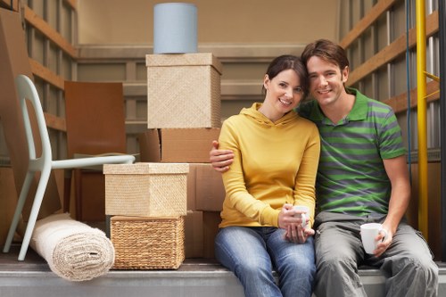 Movers carrying furniture for a home relocation in Shirley