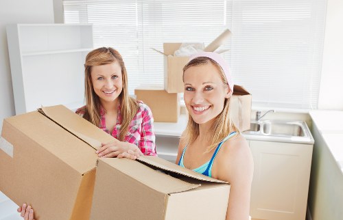 Local moving crew loading furniture into a van