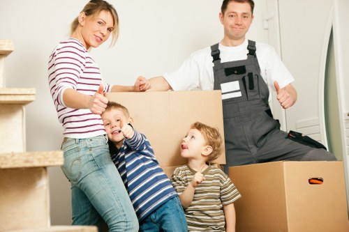 Boxes and furniture being carried during a Shirley relocation